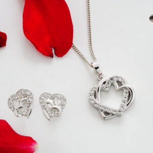 A necklace and earrings set with red petals.