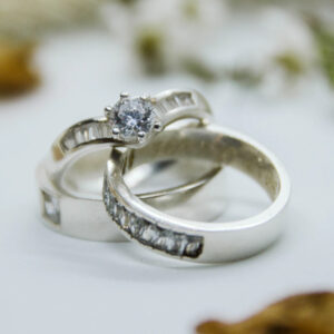 A close up of two wedding rings on top of each other