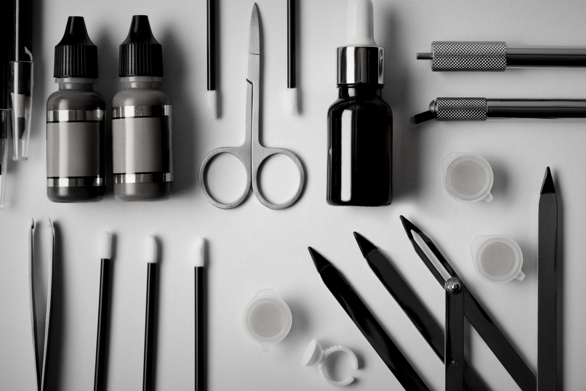 A table with various items and tools on it.